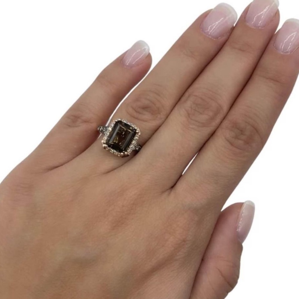 This is a quartz ring with chocolate diamonds and strawberry gold.